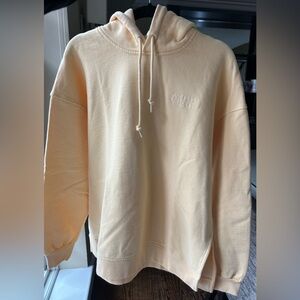 GANNI logo-embroidered oversized hoodie 
Color: Pastel Yellow